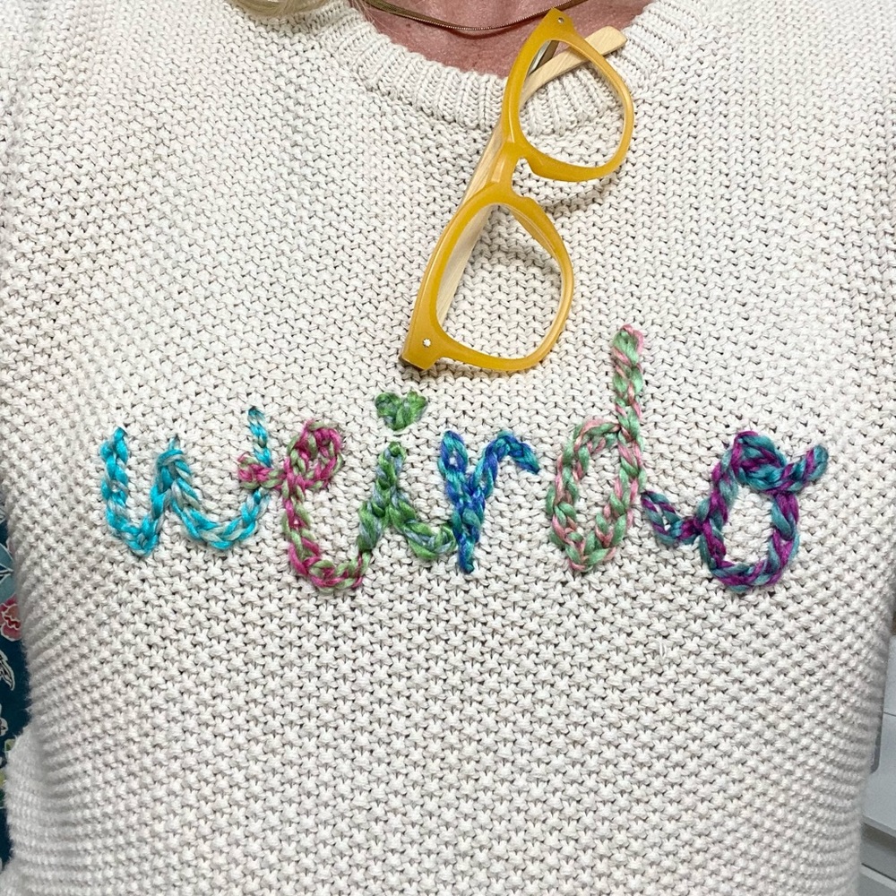 Sweater with “weirdo” hand embroidered